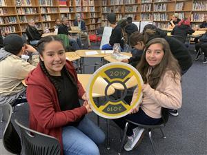 Students holding up what they created.